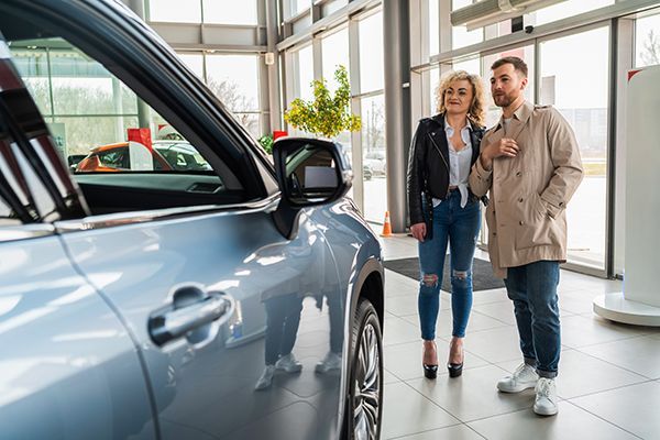 beautiful-couple-in-car-dealership-chooses-car-2024-10-20-11-06-54-utc.jpg