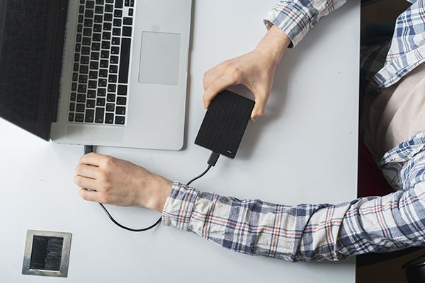 holding-a-backup-external-hdd-with-archive-and-con-2025-01-26-20-20-01-utc.JPG