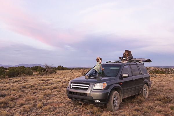 children-on-suv-at-sunset-galisteo-basin-santa-f-2023-11-27-05-34-35-utc.jpg