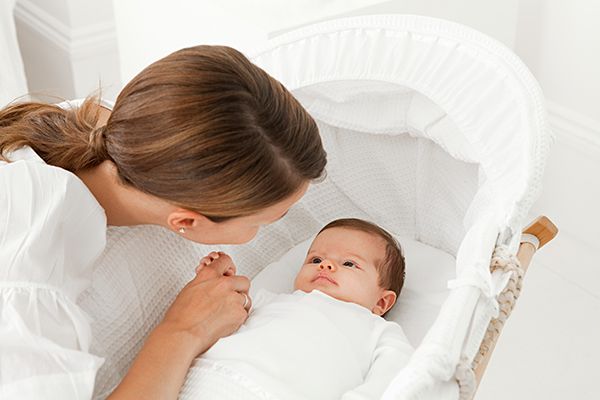 mother-with-baby-in-bassinet-2023-11-27-05-12-19-utc.jpg