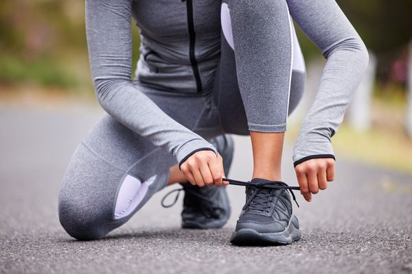 unknown-fit-woman-tying-the-laces-of-her-sneakers-2024-08-16-01-22-05-utc.jpg