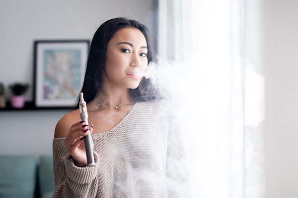 casual-asian-woman-vaping-electronic-cigarette-at-2024-10-30-23-51-11-utc.jpg