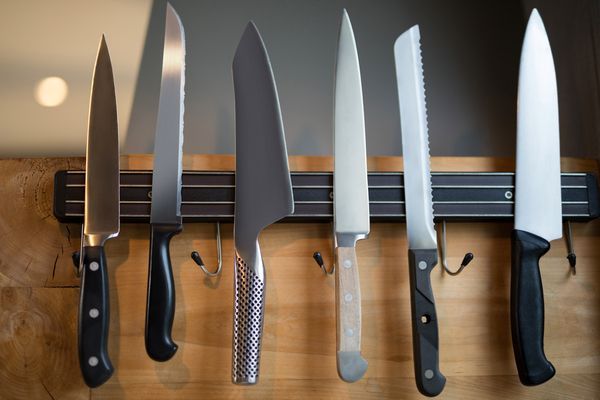 set-of-kitchen-knives-hanging-on-the-wall-2023-11-27-04-58-48-utc.jpg