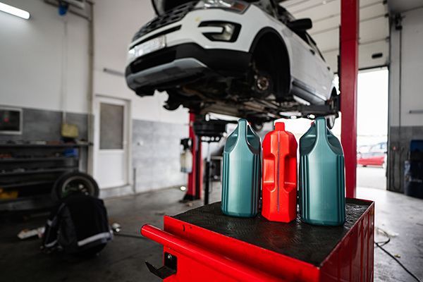 car-maintenance-in-garage-with-motor-oil-bottles-i-2024-10-03-22-49-10-utc.jpg