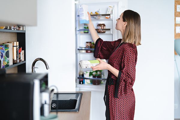 woman-looking-into-the-fridge-at-home-2024-10-19-03-30-31-utc.jpg