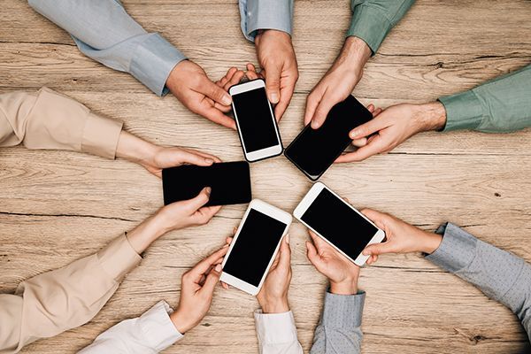 top-view-of-business-people-holding-smartphones-at-2024-11-12-04-58-38-utc.jpg