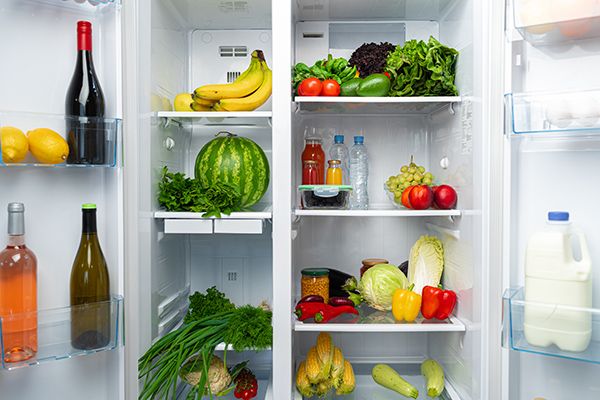 open-fridge-full-of-fruits-vegetables-and-drinks-2023-11-27-05-11-48-utc.jpg