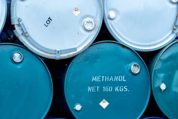 old-chemical-barrels-stack-of-blue-methanol-or-me-2023-11-27-05-28-04-utc.jpg
