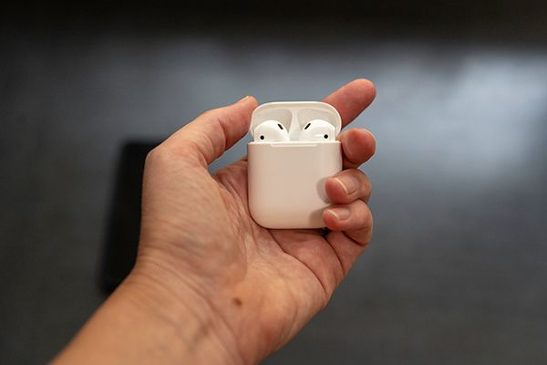wireless-apple-airpods-headphones-in-palm-of-hand-2023-11-27-04-56-54-utc.jpg