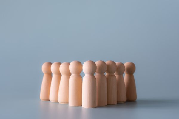 group-of-wooden-human-figures-standing-in-communit-2023-11-27-05-30-55-utc.jpg