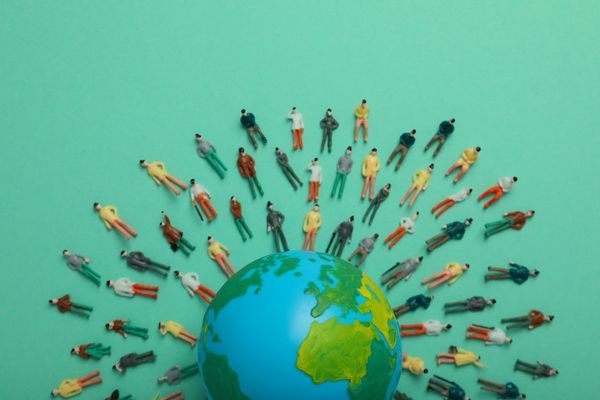 concept-of-population-with-globe-and-toy-people-2023-11-27-05-32-44-utc.jpg
