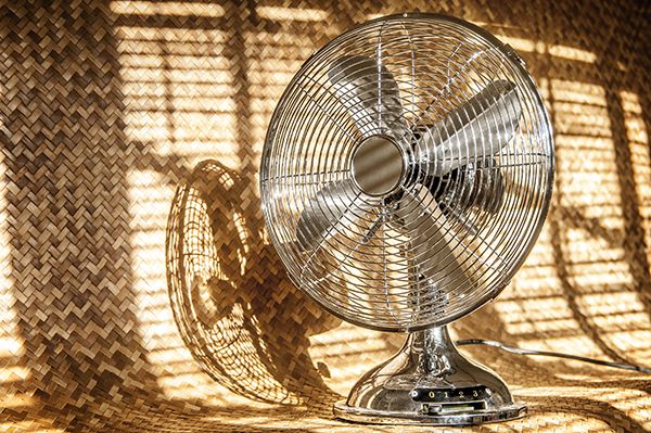 vintage-metal-fan-against-rattan-mat-backdrop-2024-11-27-03-37-06-utc.jpg