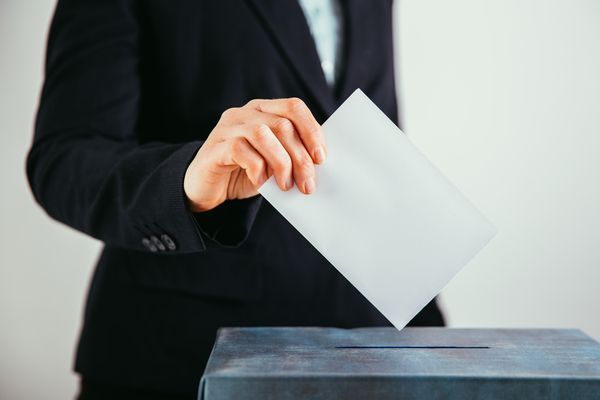 close-up-of-voter-putting-ballot-into-voting-box-2024-10-14-05-26-46-utc.jpg