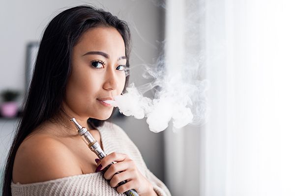 casual-asian-woman-vaping-electronic-cigarette-at-2024-10-31-01-20-04-utc.jpg