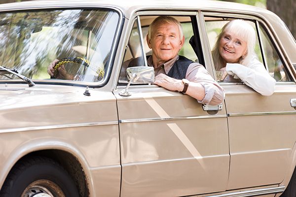 side-view-of-attractive-senior-couple-in-beige-car-2024-11-10-15-29-31-utc.jpg