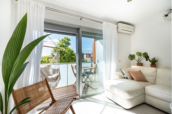 interior-of-spacious-living-room-with-balcony-2023-11-27-05-29-15-utc.jpg