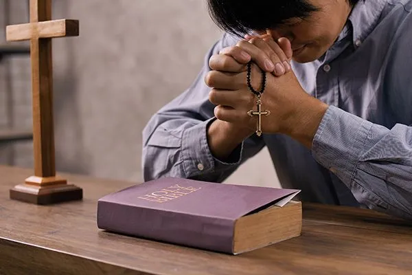 a-young-asian-christian-man-praying-to-jesus-chris-2025-02-22-03-52-46-utc.jpg